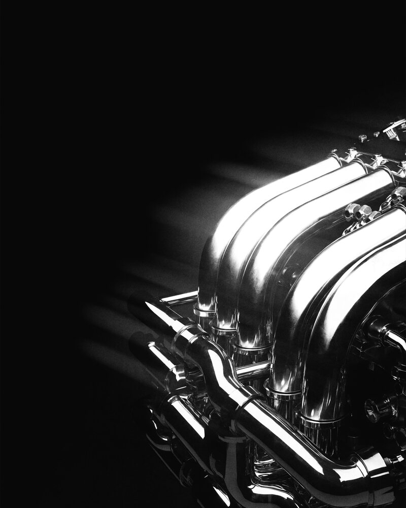 A twelve-cylinder engine bay seen at a cold start
