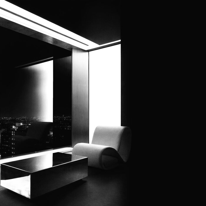 A high penthouse interior overlooking a city skyline