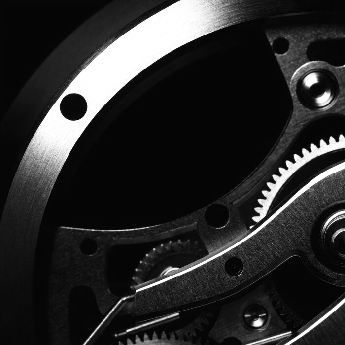 A close macro of a luxury watch dial and case